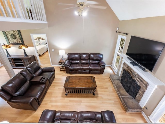 5020 Bayberry Dr, Cumming, GA 30040 - living area with high vaulted ceiling, wood finished floors, a ceiling fan, and a fireplace with raised hearth