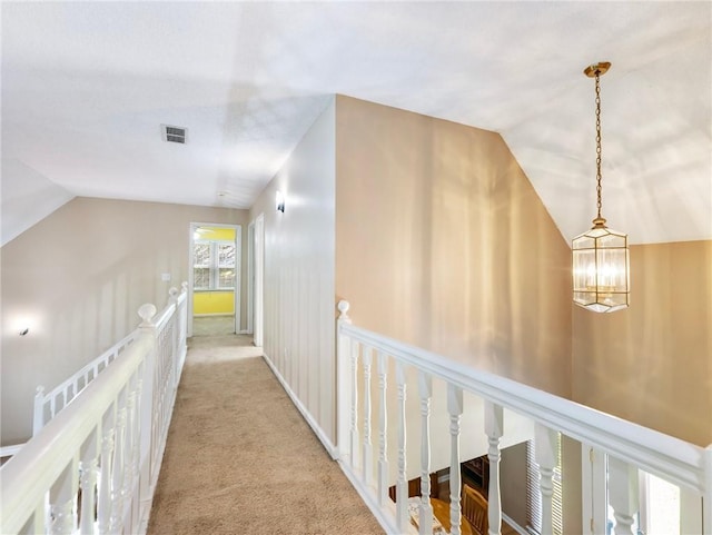 5020 Bayberry Dr, Cumming, GA 30040 - corridor featuring an upstairs landing, lofted ceiling, carpet floors, and a chandelier