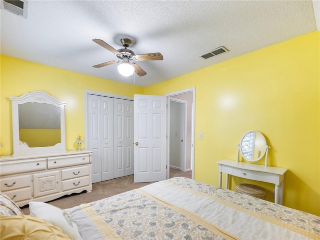 5020 Bayberry Dr, Cumming, GA 30040 - carpeted bedroom featuring ceiling fan, a textured ceiling, and a closet