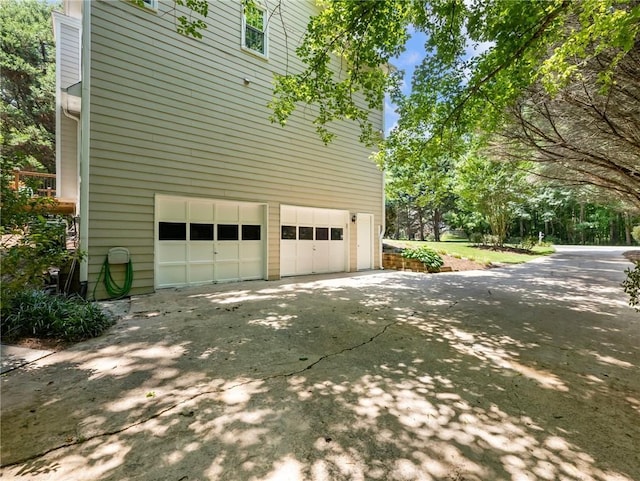 5020 Bayberry Dr, Cumming, GA 30040 - view of side of property featuring a garage and concrete driveway