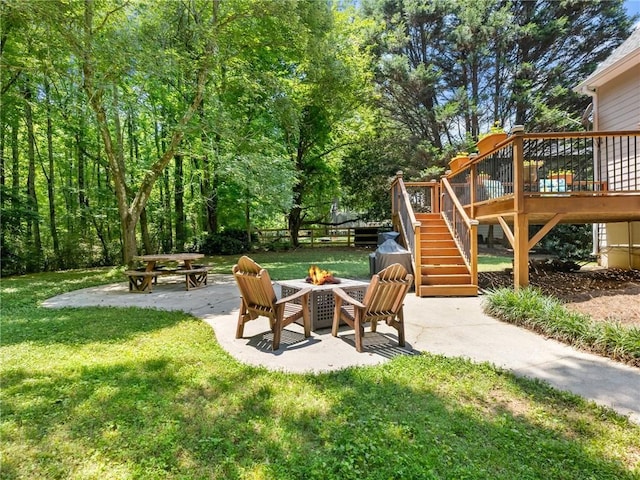 5020 Bayberry Dr, Cumming, GA 30040 - view of green lawn featuring stairway, an outdoor fire pit, a patio area, and a deck