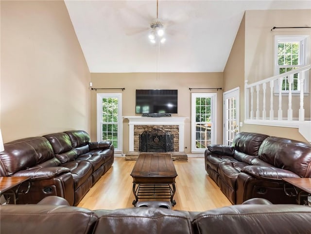 5020 Bayberry Dr, Cumming, GA 30040 - living area featuring ceiling fan, wood finished floors, high vaulted ceiling, and a stone fireplace