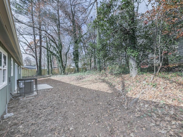 view of yard featuring cooling unit and a patio area