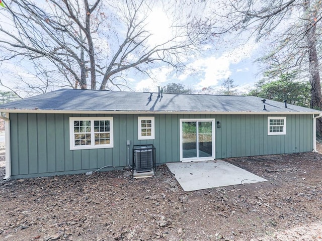 rear view of property with central AC and a patio area