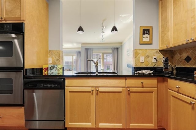 kitchen with tasteful backsplash, sink, kitchen peninsula, pendant lighting, and stainless steel appliances