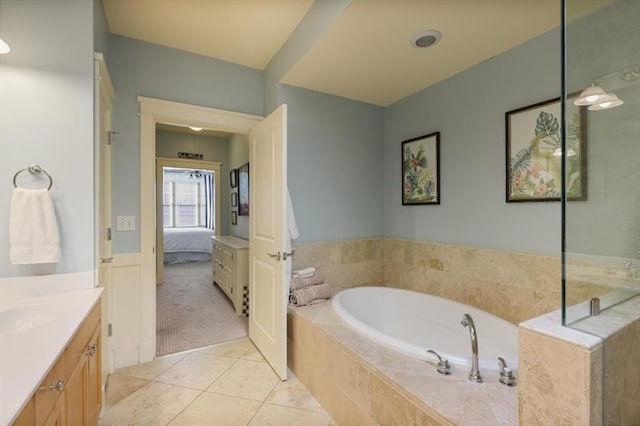 bathroom with plus walk in shower, vanity, and tile patterned flooring