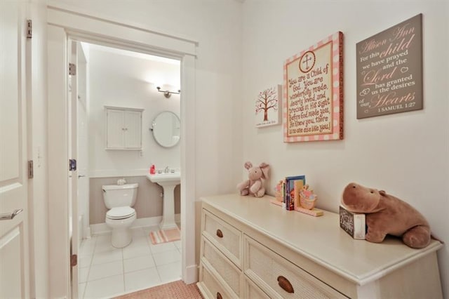 bathroom with tile patterned floors and toilet