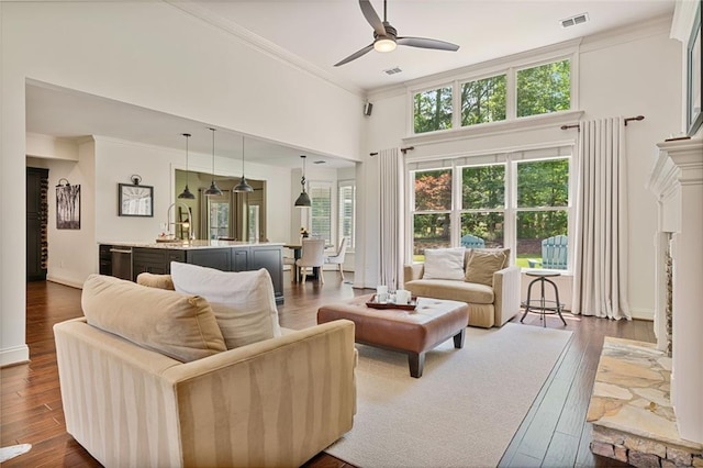 410 Longwood Ln, Alpharetta, GA 30004 - living area with a ceiling fan, dark wood-style floors, plenty of natural light, crown molding, and a towering ceiling