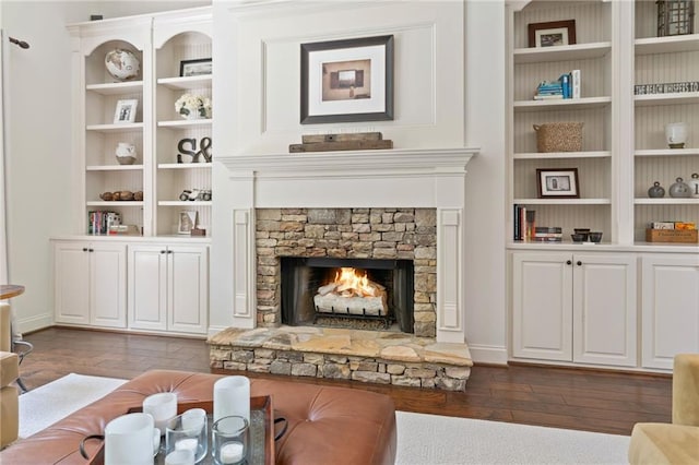 410 Longwood Ln, Alpharetta, GA 30004 - living area with dark wood-style floors, a fireplace, built in shelves, and baseboards