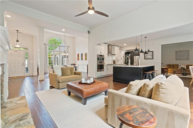 410 Longwood Ln, Alpharetta, GA 30004 - living room with ornamental molding, hardwood / wood-style flooring, a ceiling fan, a chandelier, and recessed lighting