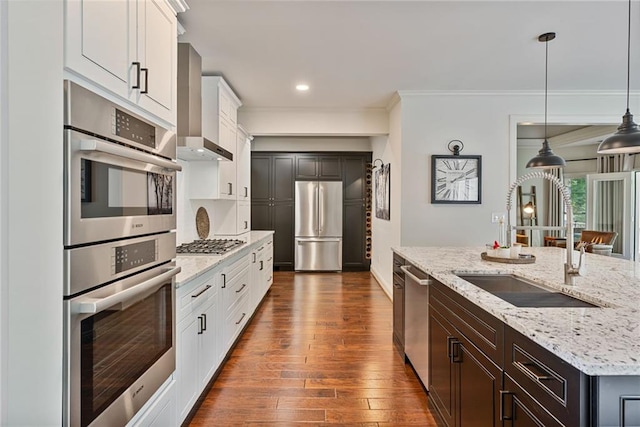 410 Longwood Ln, Alpharetta, GA 30004 - kitchen featuring a sink, stainless steel appliances, dark wood-style floors, crown molding, and wall chimney exhaust hood