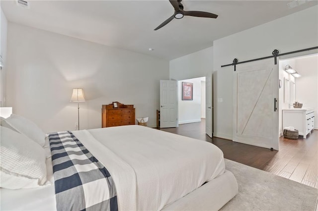410 Longwood Ln, Alpharetta, GA 30004 - bedroom featuring a barn door, wood finished floors, and ceiling fan