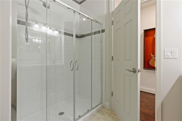 410 Longwood Ln, Alpharetta, GA 30004 - full bath with a stall shower, wood finished floors, and baseboards