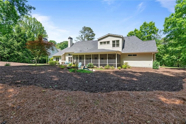 410 Longwood Ln, Alpharetta, GA 30004 - rear view of property featuring a sunroom, a chimney, and roof with shingles