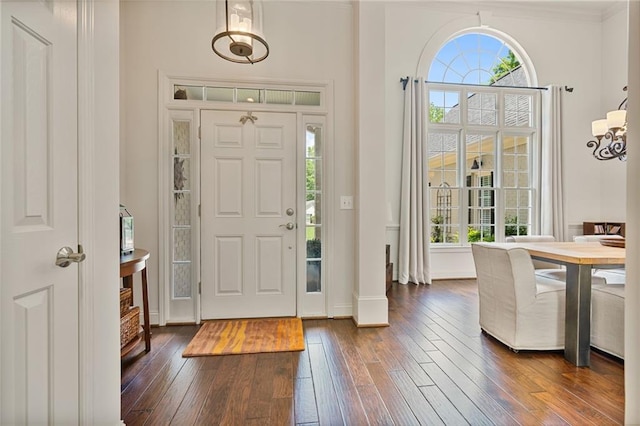 410 Longwood Ln, Alpharetta, GA 30004 - foyer entrance with dark wood finished floors, baseboards, and a chandelier