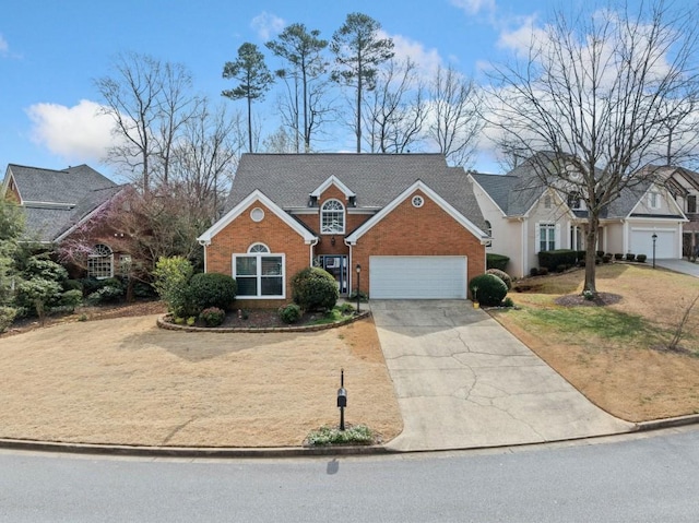 traditional-style home featuring a front yard, brick siding, concrete driveway, and an attached garage