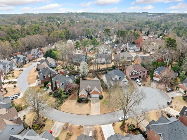 bird's eye view with a residential view and a wooded view