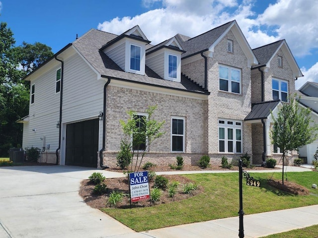 2949 Longbush, Duluth, GA 30097 - view of front of property with an attached garage, a front yard, concrete driveway, and brick siding