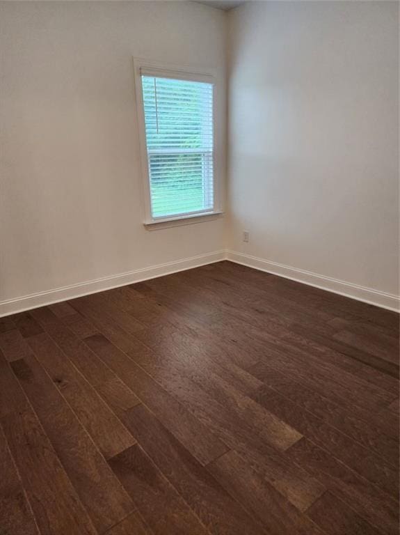 2949 Longbush, Duluth, GA 30097 - unfurnished room featuring dark wood-style floors and baseboards