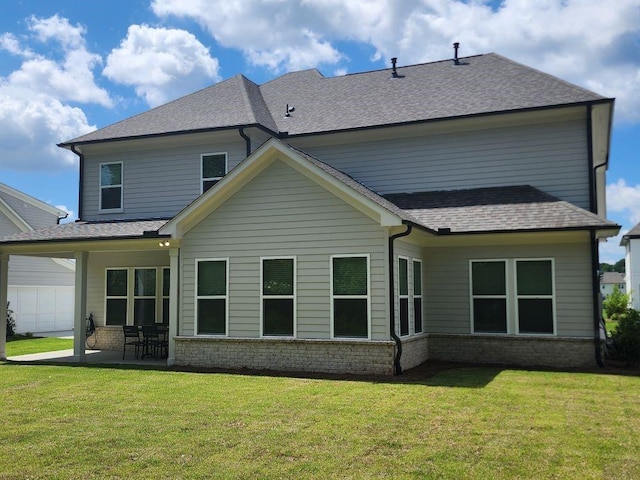 2949 Longbush, Duluth, GA 30097 - rear view of house featuring a yard, a patio area, a shingled roof, and brick siding