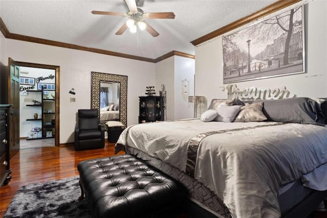 bedroom with ornamental molding, a textured ceiling, ceiling fan, and dark hardwood / wood-style flooring