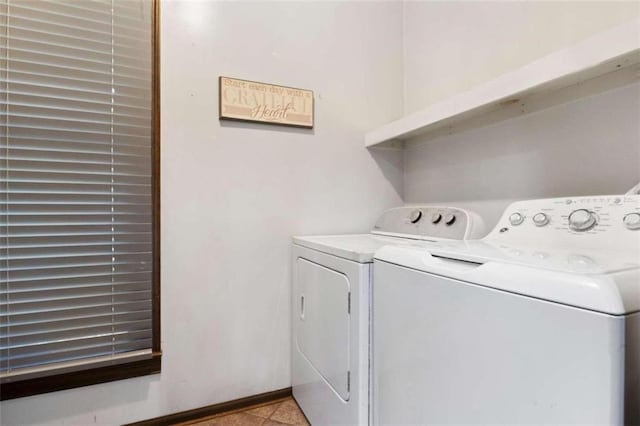 clothes washing area featuring washing machine and clothes dryer