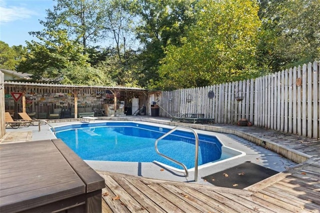 view of pool with a wooden deck