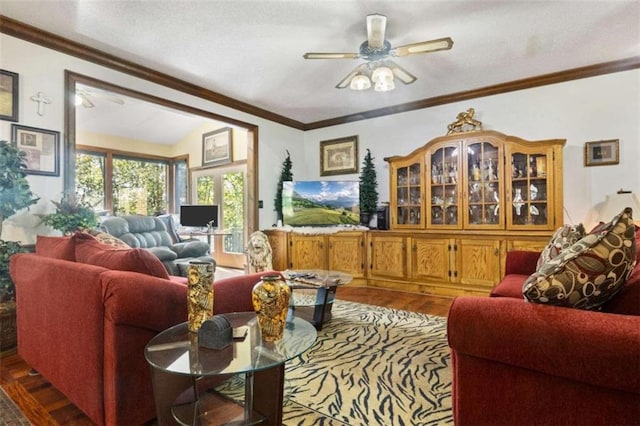 living room with vaulted ceiling, ceiling fan, hardwood / wood-style floors, and crown molding