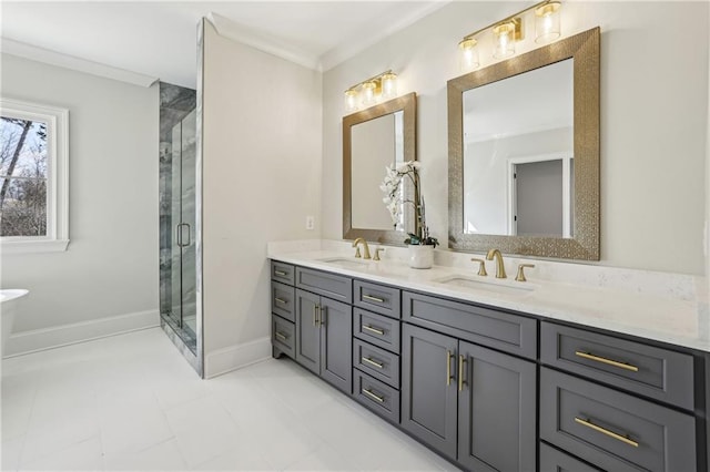 full bathroom with a sink, ornamental molding, and a shower stall