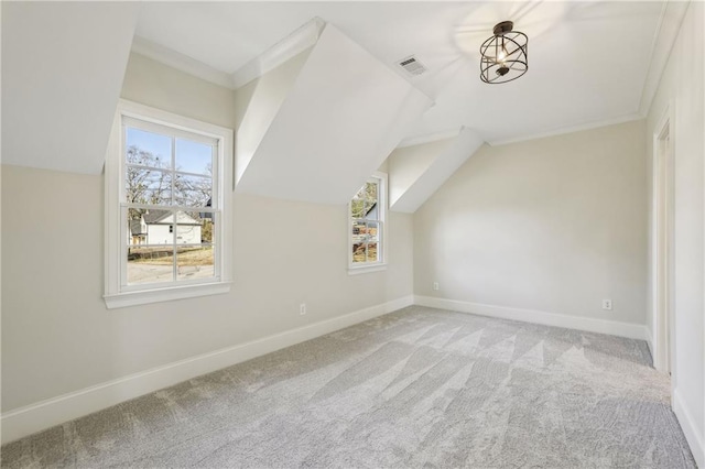 bonus room with visible vents, baseboards, carpet flooring, and vaulted ceiling