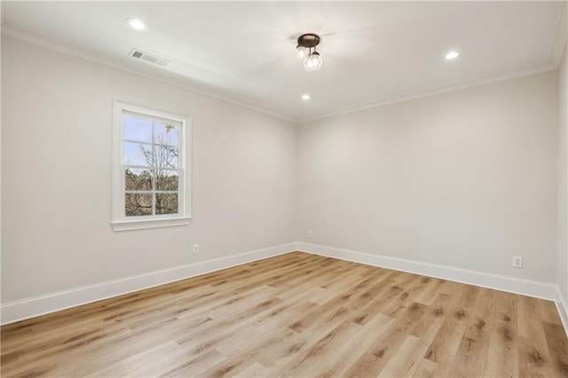 unfurnished room with recessed lighting, light wood-style flooring, baseboards, and ornamental molding