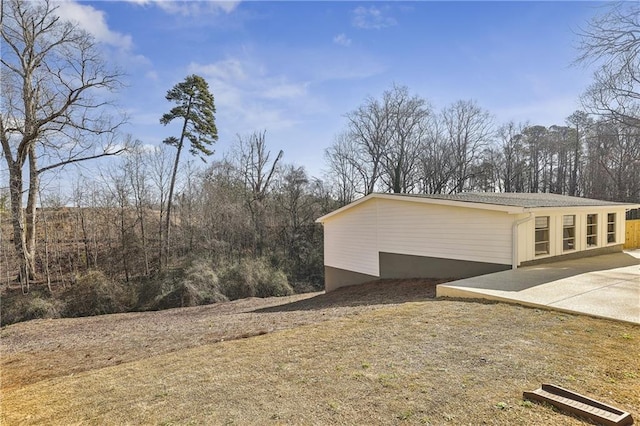 view of home's exterior with a patio