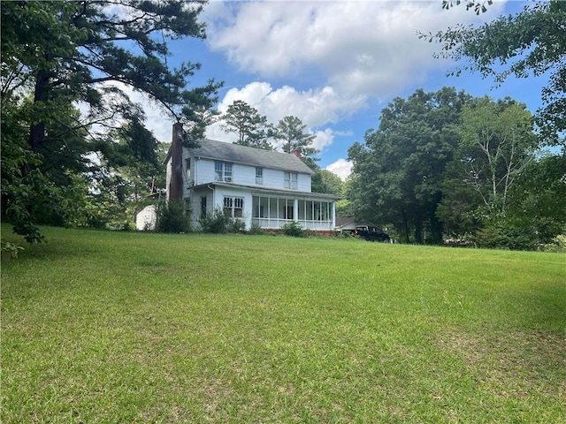 view of yard featuring a sunroom