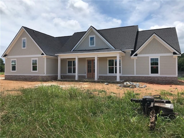 107 Telluride Trl NE, Calhoun, GA 30701 - craftsman inspired home with brick siding, roof with shingles, and covered porch