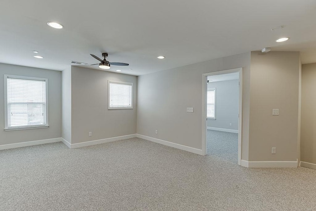 spare room featuring visible vents, recessed lighting, baseboards, and ceiling fan