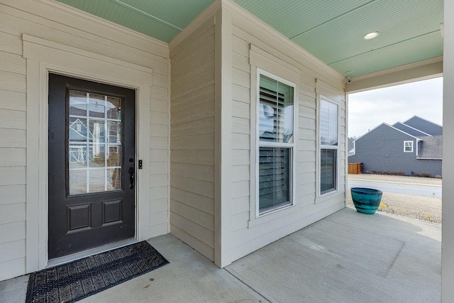 entrance to property featuring covered porch