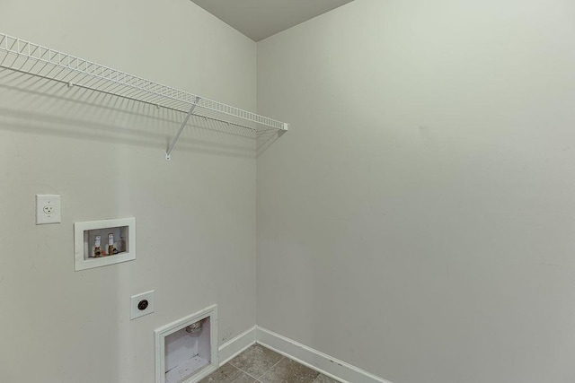 laundry area featuring electric dryer hookup, baseboards, hookup for a washing machine, and laundry area