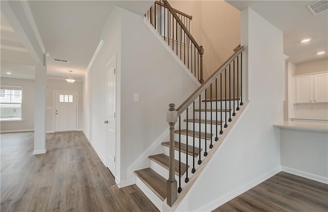 stairway featuring hardwood / wood-style floors