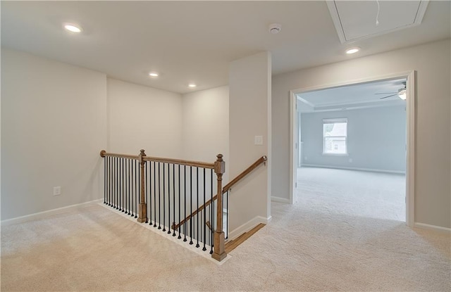 hallway with light colored carpet