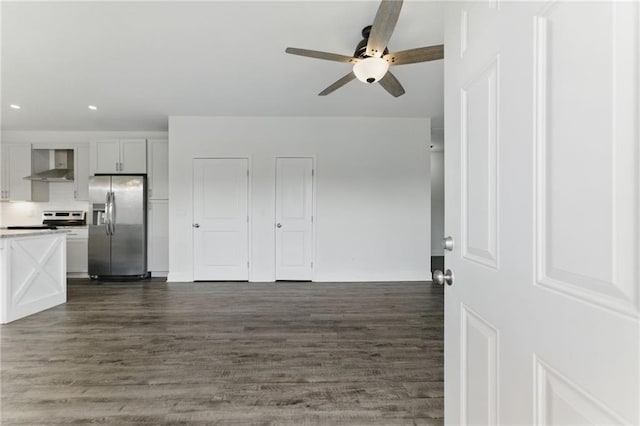 interior space featuring dark wood finished floors, a ceiling fan, and recessed lighting