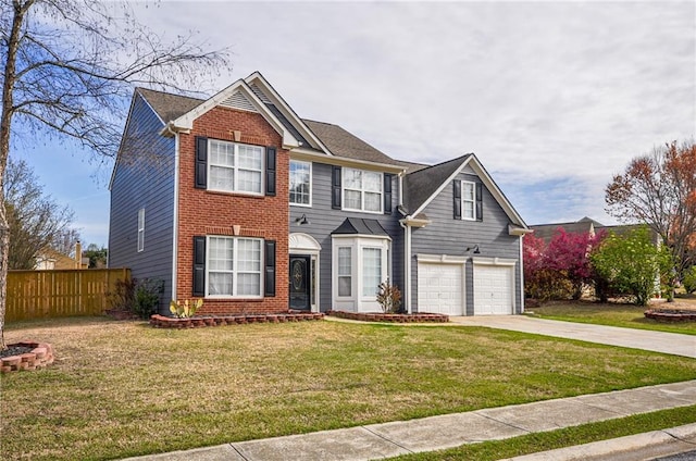 view of front of home featuring a front lawn and a garage