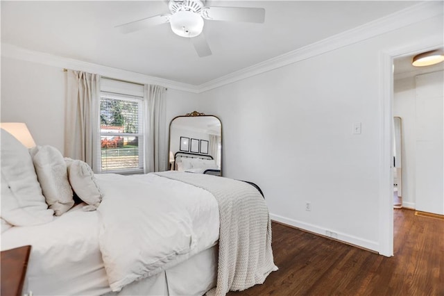 bedroom featuring dark wood-type flooring, ceiling fan, and ornamental molding