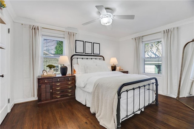 bedroom featuring ceiling fan, ornamental molding, and dark hardwood / wood-style floors