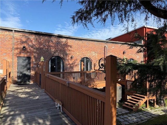 rear view of house with brick siding