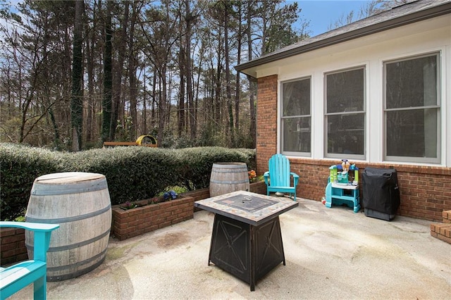 view of patio / terrace featuring a fire pit