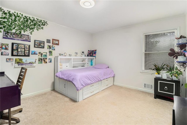 bedroom featuring baseboards, visible vents, and carpet flooring