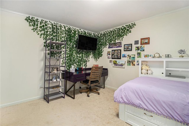 bedroom with crown molding, baseboards, and carpet flooring