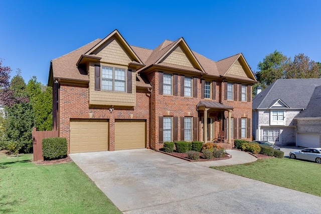 view of front of house with a garage and a front lawn