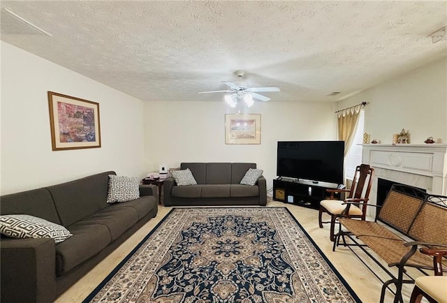 5421 Skylar Creek Ln, Buford, GA 30518 - living room with a ceiling fan, a textured ceiling, a fireplace, and light colored carpet