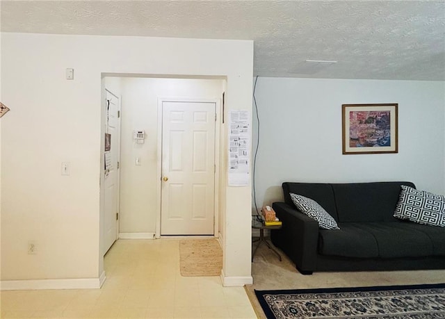 5421 Skylar Creek Ln, Buford, GA 30518 - living room featuring baseboards and a textured ceiling
